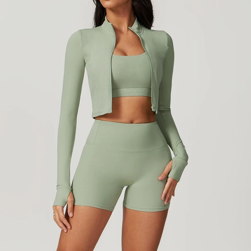 Women's 3 piece yoga set with sports bra, high-waisted shorts and zip-up thumbhole jacket green