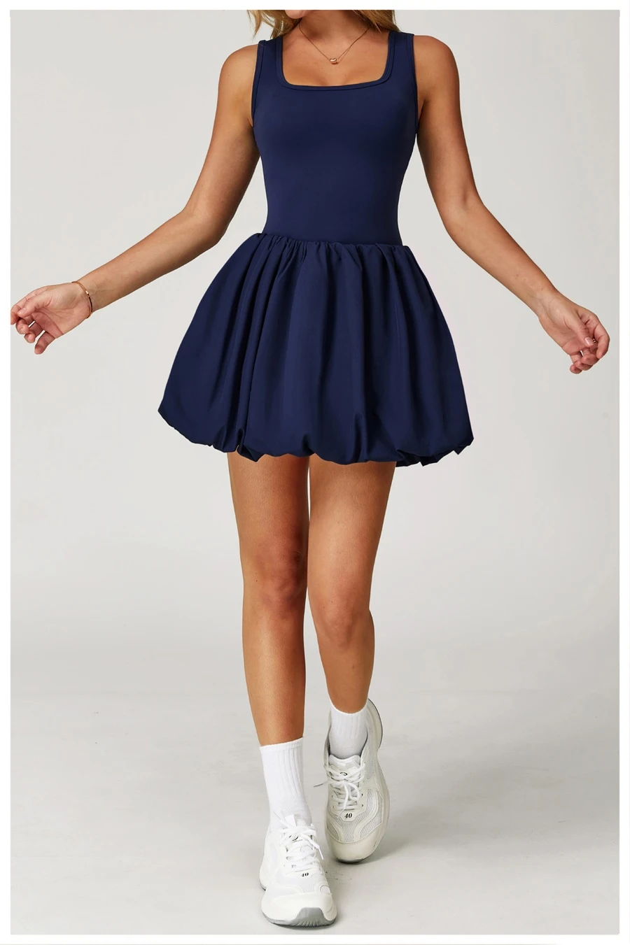 2-in-1 sports dress with built-in shorts for women in dark blue, featuring flounce bubble hem and gathered waist