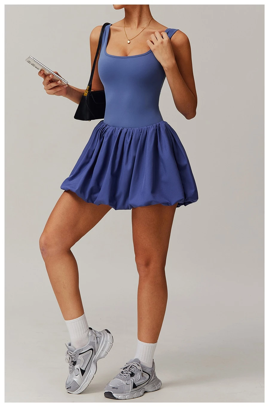 2-in-1 sports dress with built-in shorts for women in purple, featuring flounce bubble hem and gathered waist