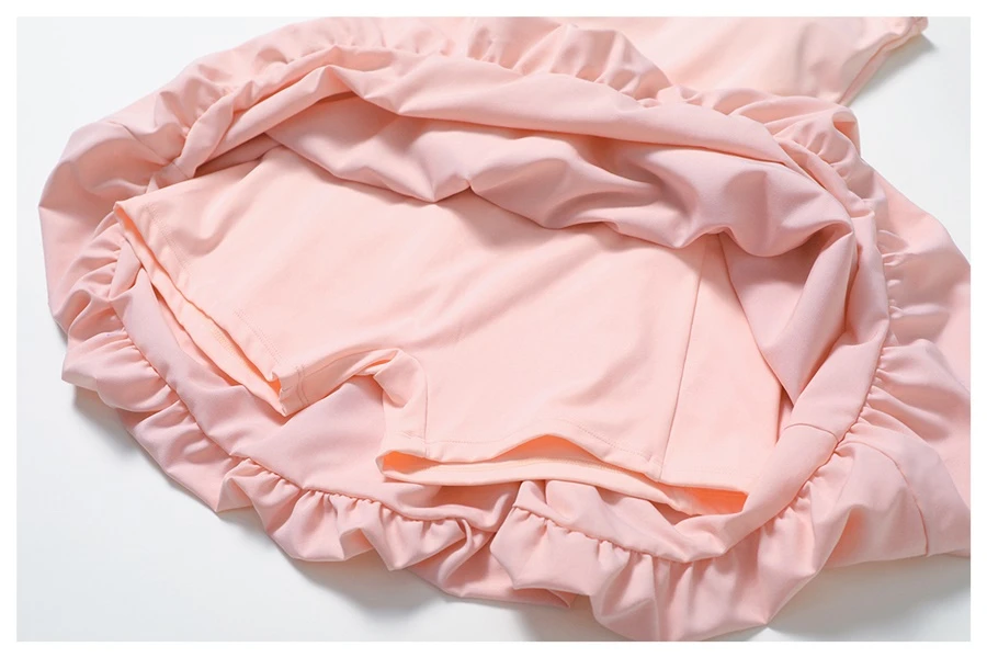 2-in-1 layered sports dress showing elegant overlay with built-in modesty shorts underneath