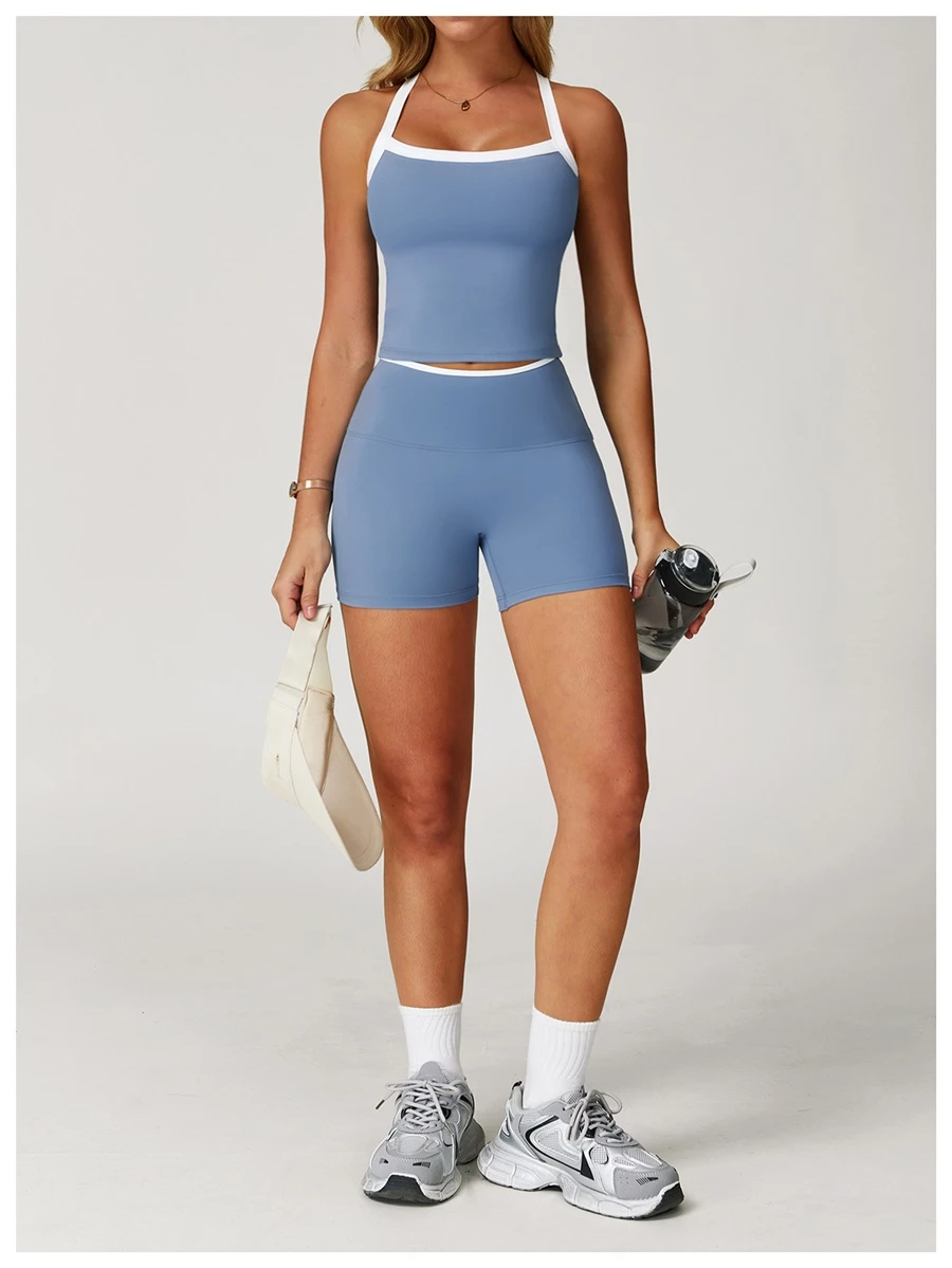 Woman wearing stylish backless yoga tank top during fitness workout-misty blue