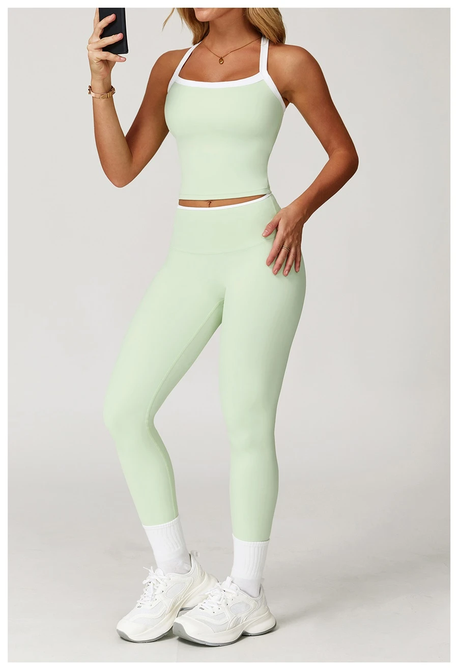 Woman wearing stylish backless yoga tank top during fitness workout-light green