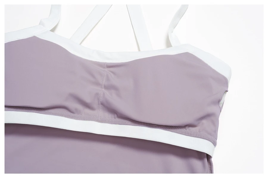 Backless yoga sports top with removable chest pads and four way stretch fabric