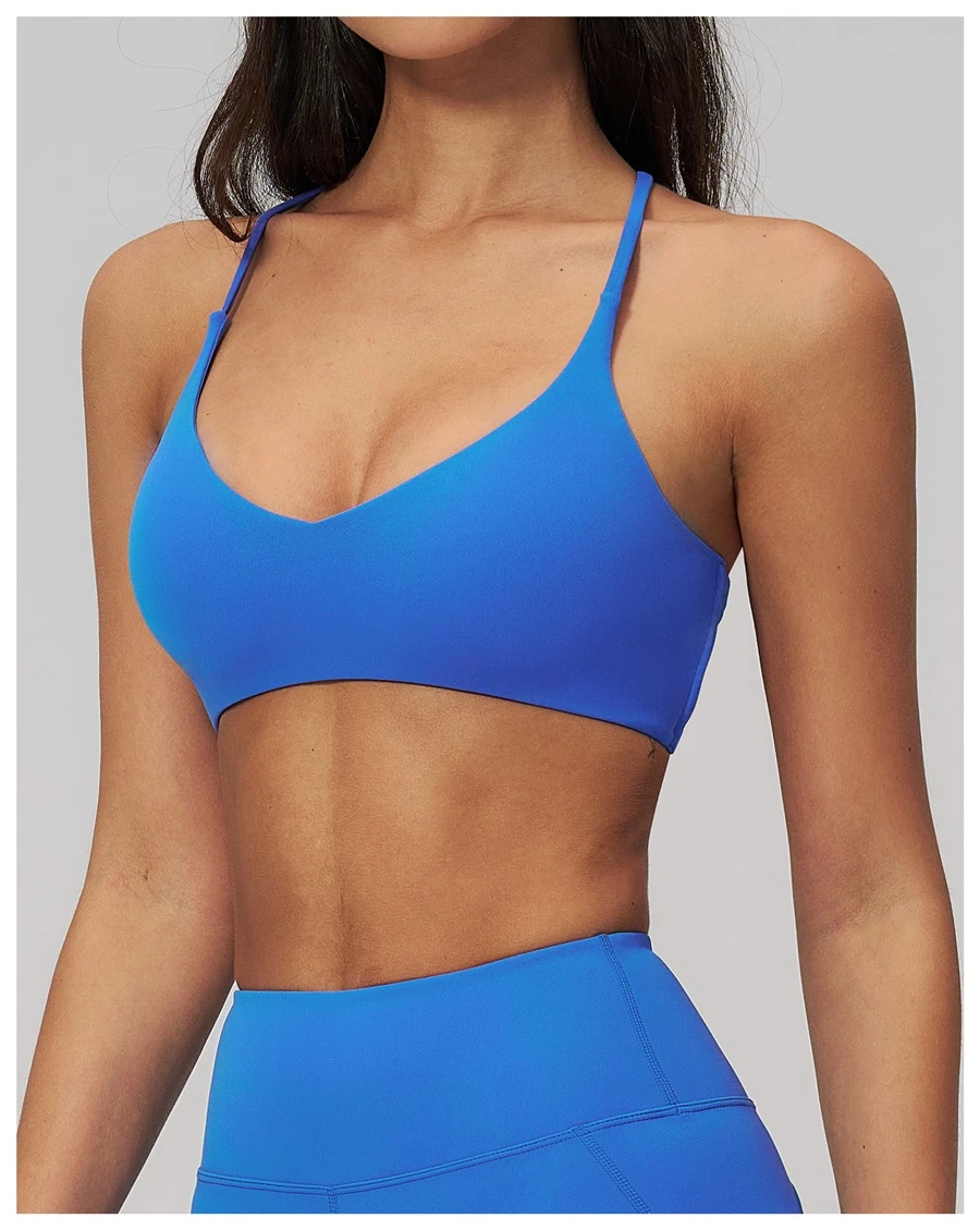 side view for cross back sports bra-blue