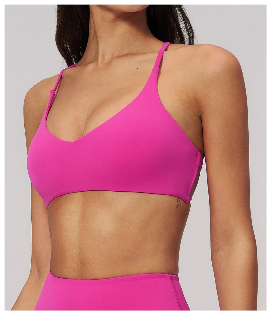 side view for cross back sports bra -magenta