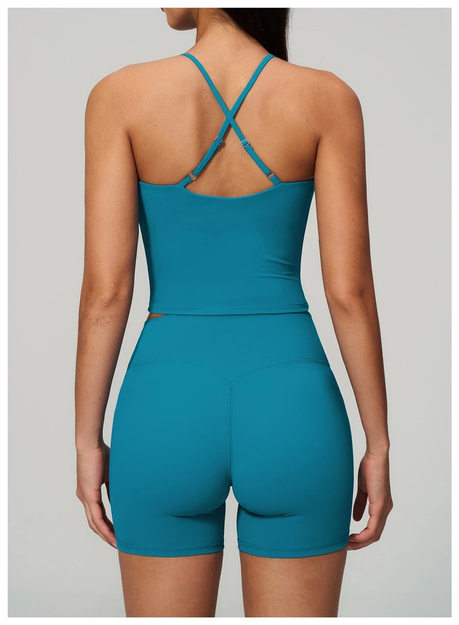 Cross back yoga tank top highlighting elegant open back design-peacock blue