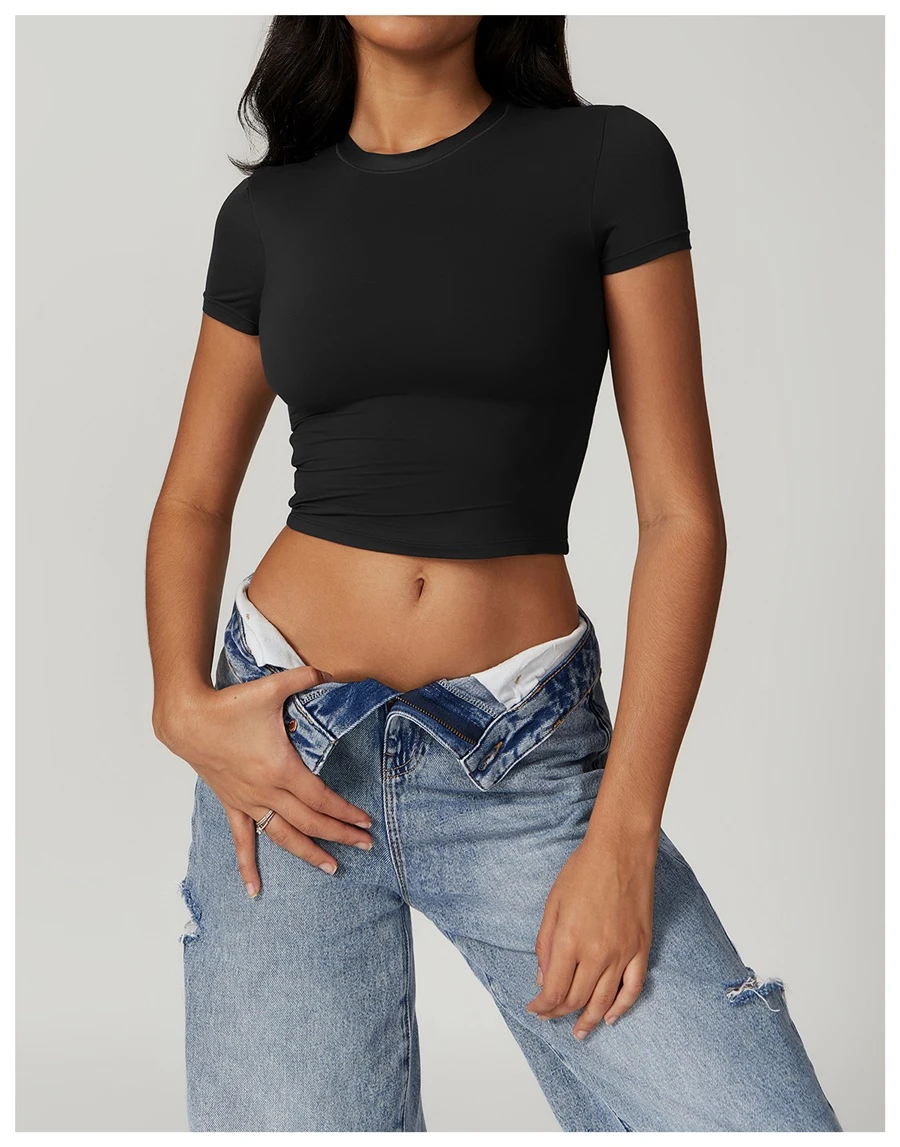 Women's cropped short sleeve yoga top in brushed four-way stretch fabric for yoga, Pilates, running, gym workouts, and activewear-black front view