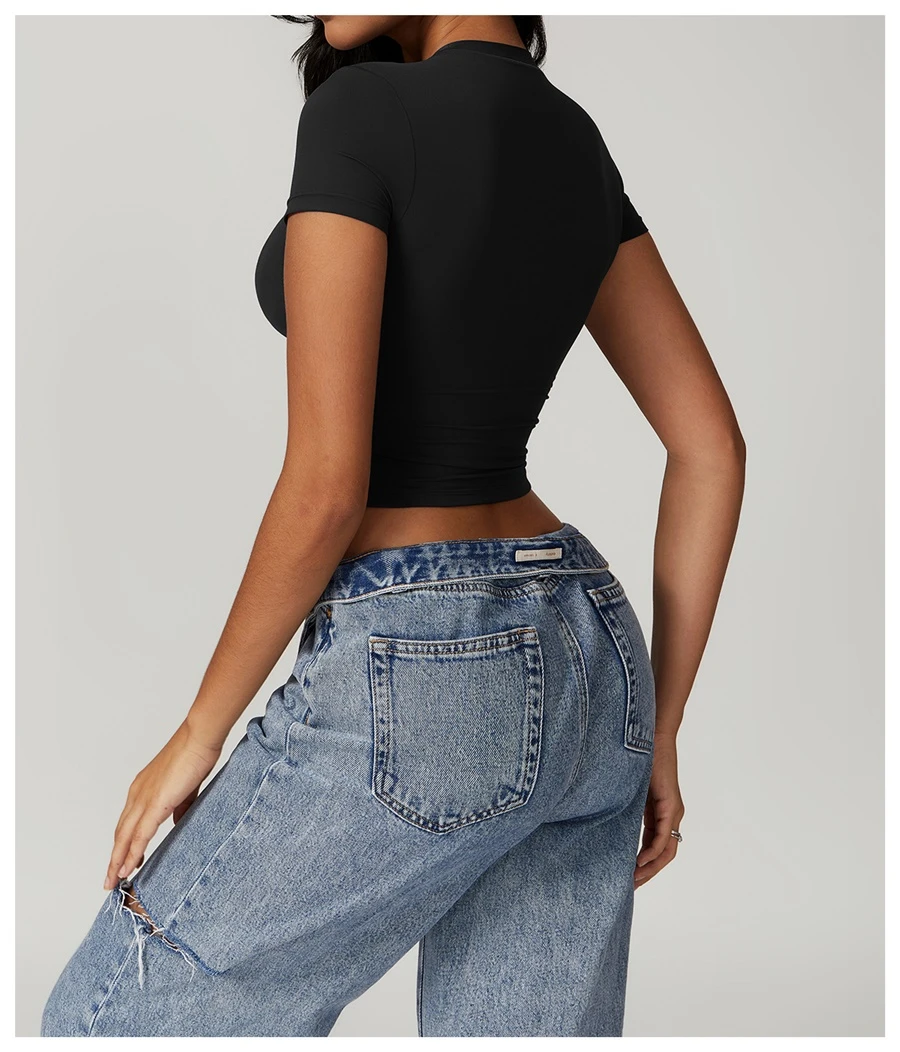 Women's cropped short sleeve yoga top in brushed four-way stretch fabric for yoga, Pilates, running, gym workouts, and activewear-black back view