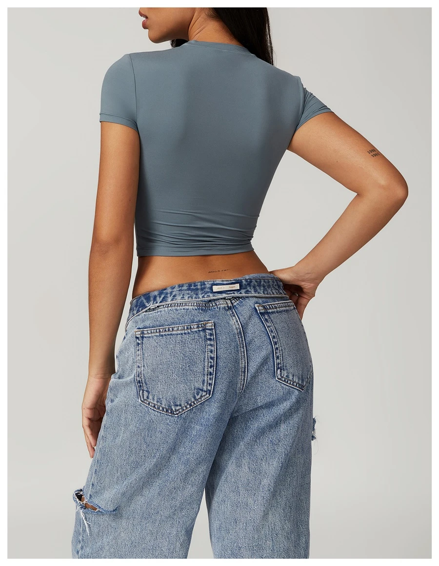 Women's cropped short sleeve yoga top in brushed four-way stretch fabric for yoga, Pilates, running, gym workouts, and activewear-blue grey back view
