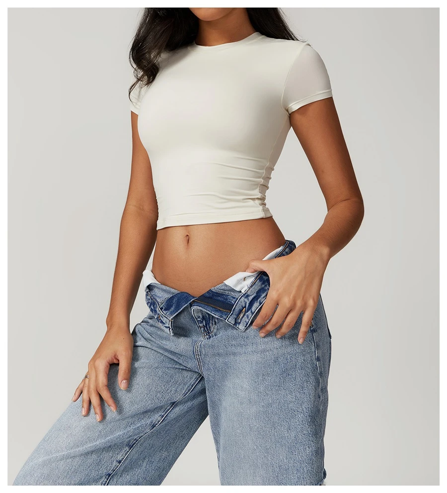Women's cropped short sleeve yoga top in brushed four-way stretch fabric for yoga, Pilates, running, gym workouts, and activewear-cream apricot front view