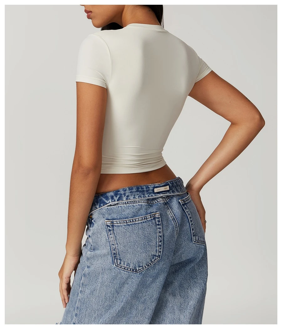 Women's cropped short sleeve yoga top in brushed four-way stretch fabric for yoga, Pilates, running, gym workouts, and activewear-cream apricot back view