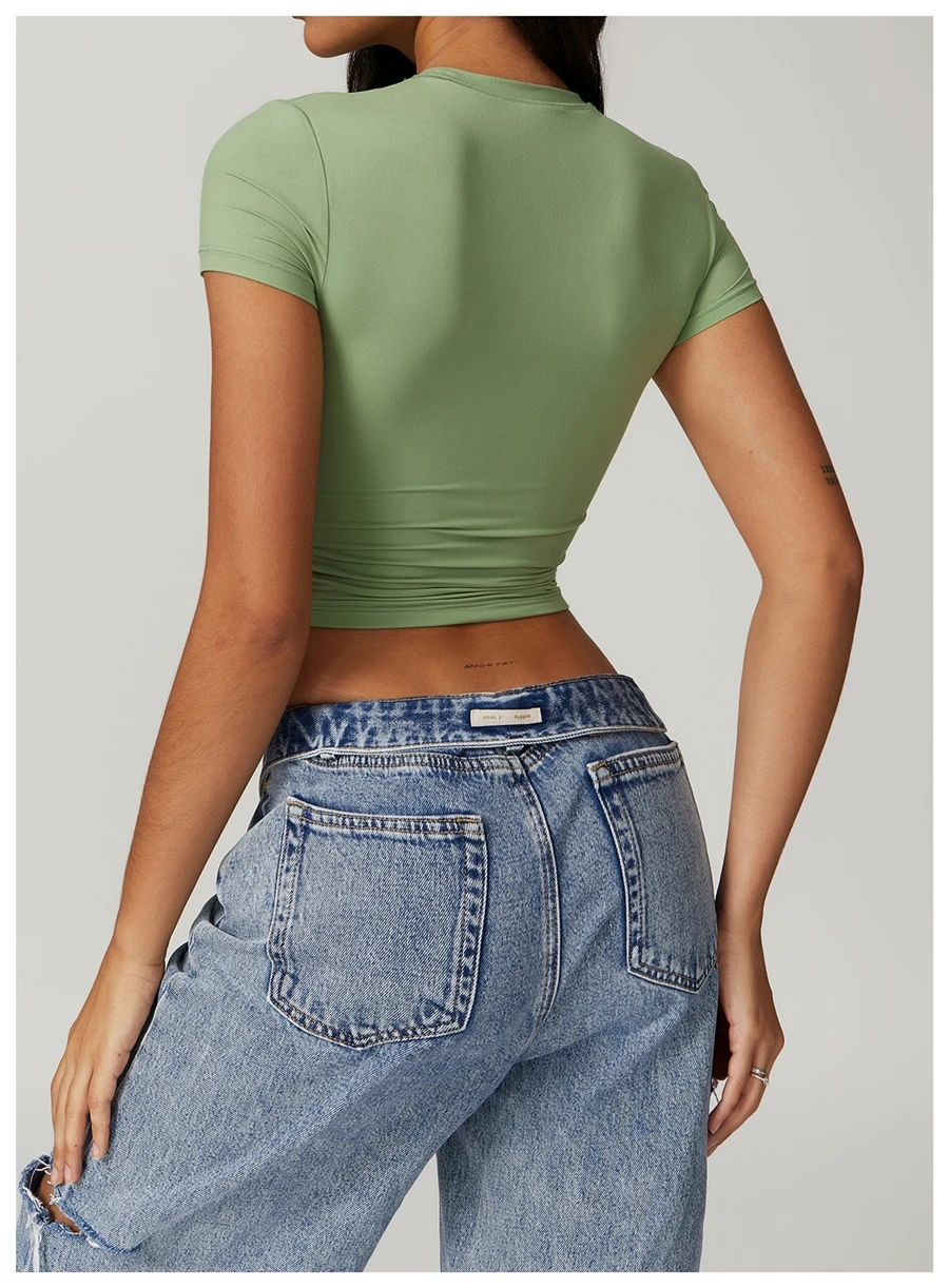 Women's cropped short sleeve yoga top in brushed four-way stretch fabric for yoga, Pilates, running, gym workouts, and activewear-green back view