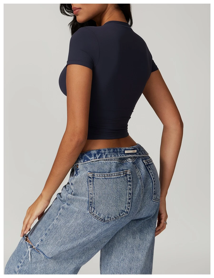 Women's cropped short sleeve yoga top in brushed four-way stretch fabric for yoga, Pilates, running, gym workouts, and activewear-insignia blue back view