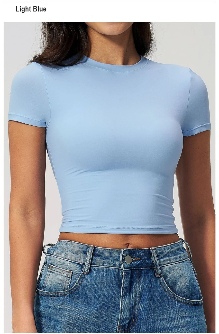 Women's cropped short sleeve yoga top in brushed four-way stretch fabric for yoga, Pilates, running, gym workouts, and activewear-light blue front view