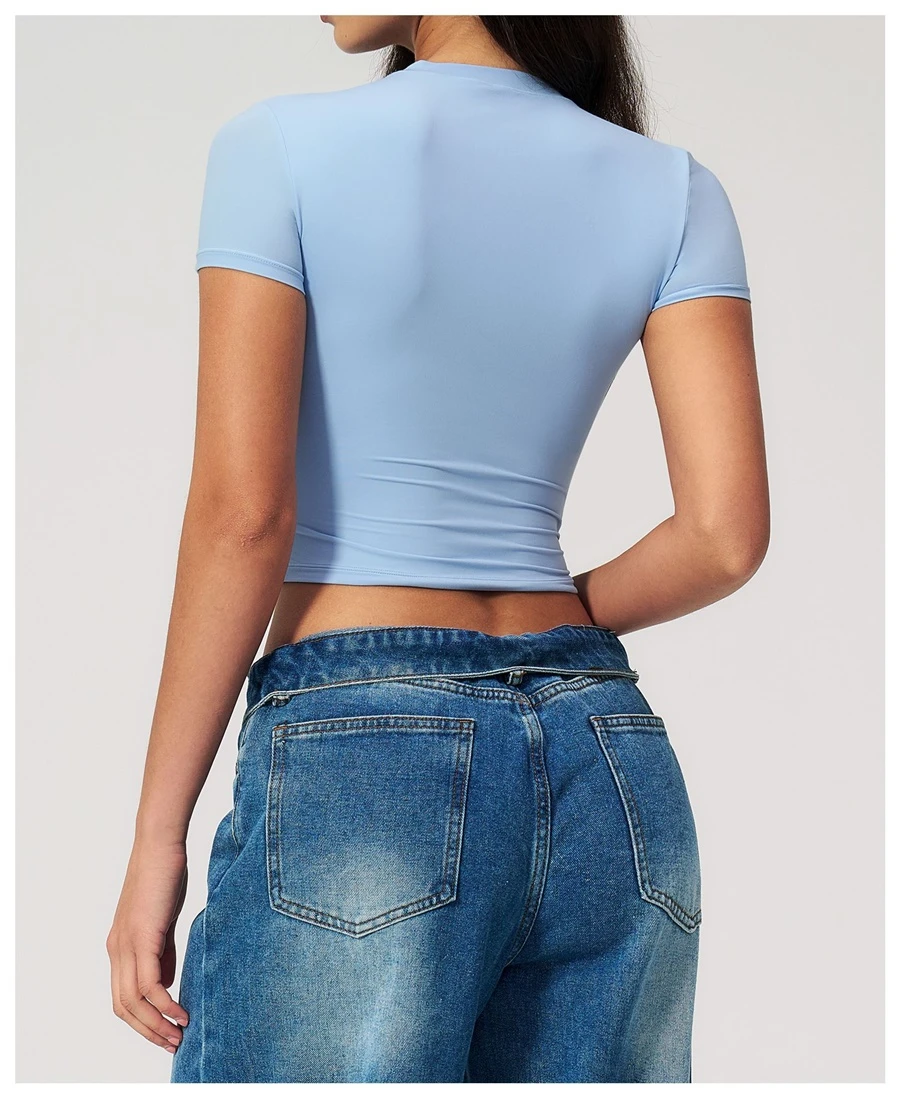 Women's cropped short sleeve yoga top in brushed four-way stretch fabric for yoga, Pilates, running, gym workouts, and activewear-light blue back view