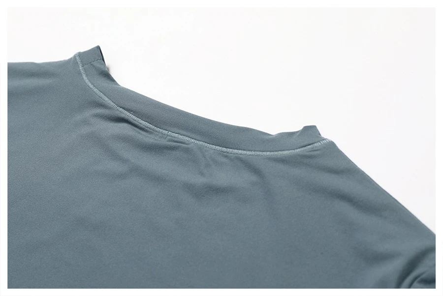 Women's cropped short sleeve yoga top in brushed four-way stretch fabric for yoga, Pilates, running, gym workouts, and activewear-actual close up