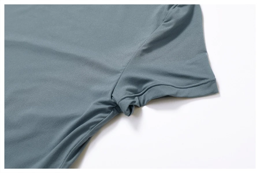 Women's cropped short sleeve yoga top in brushed four-way stretch fabric for yoga, Pilates, running, gym workouts, and activewear-actual close up