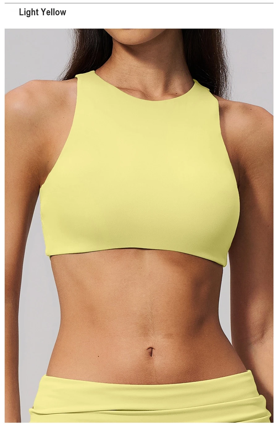 Woman wearing high impact backless sports bra during yoga and gym training-yellow