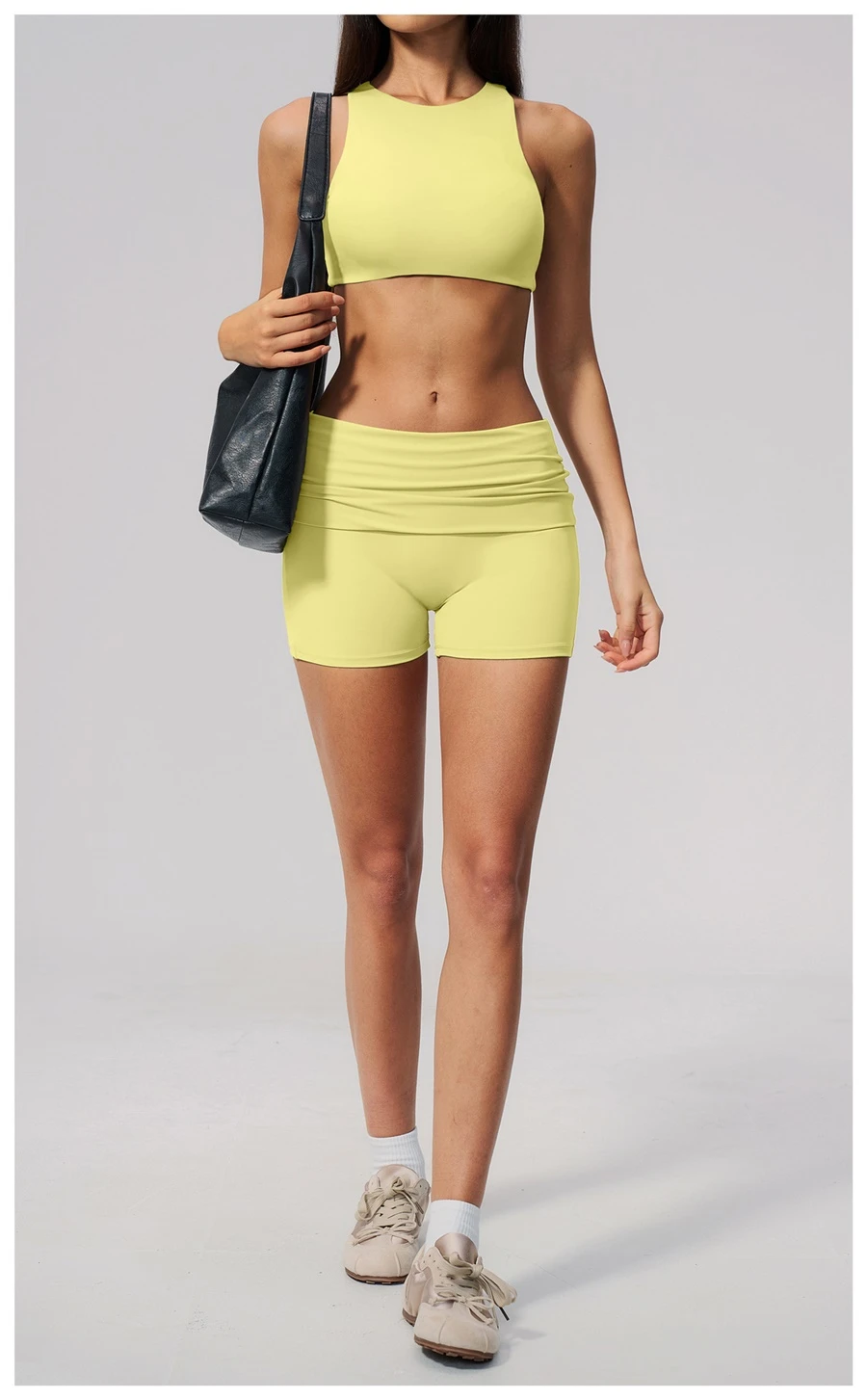 Woman wearing high impact backless sports bra during yoga and gym training-yellow