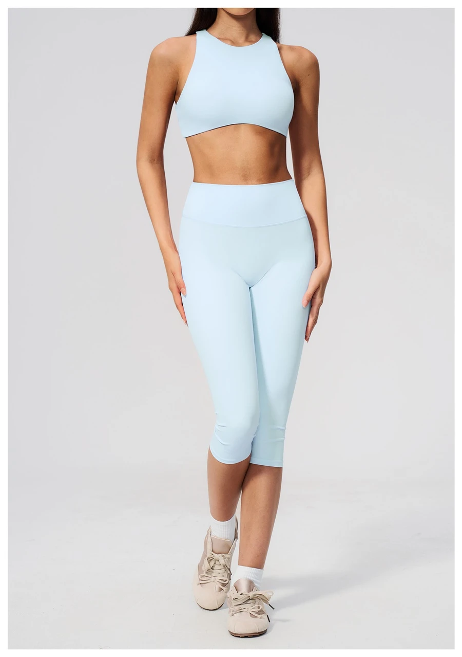 Woman wearing high impact backless sports bra during yoga and gym training-fantasy blue