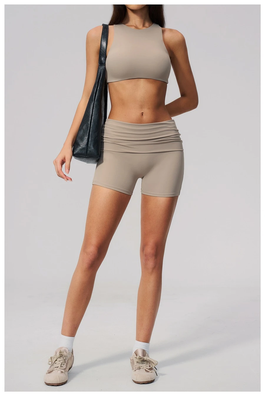 Woman wearing high impact backless sports bra during yoga and gym training-flaxen
