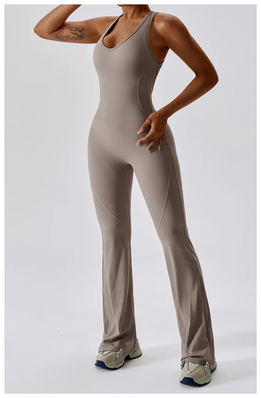 Flare bottom yoga bodysuit for women in black, featuring U-neckline and dancer-inspired silhouette