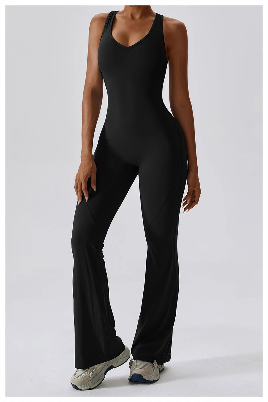 Flare bottom yoga bodysuit for women in black, featuring U-neckline and dancer-inspired silhouette