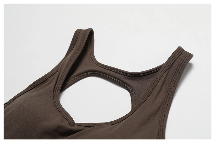 Close-up of open back design on yoga bodysuit showcasing elegant butterfly bone cut-out