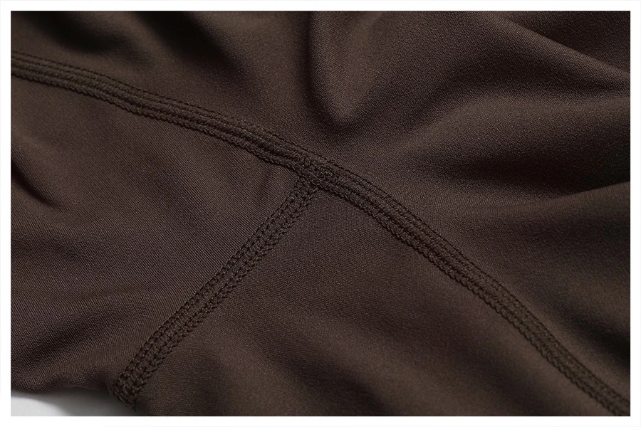 Close-up of open back design on yoga bodysuit showcasing elegant butterfly bone cut-out