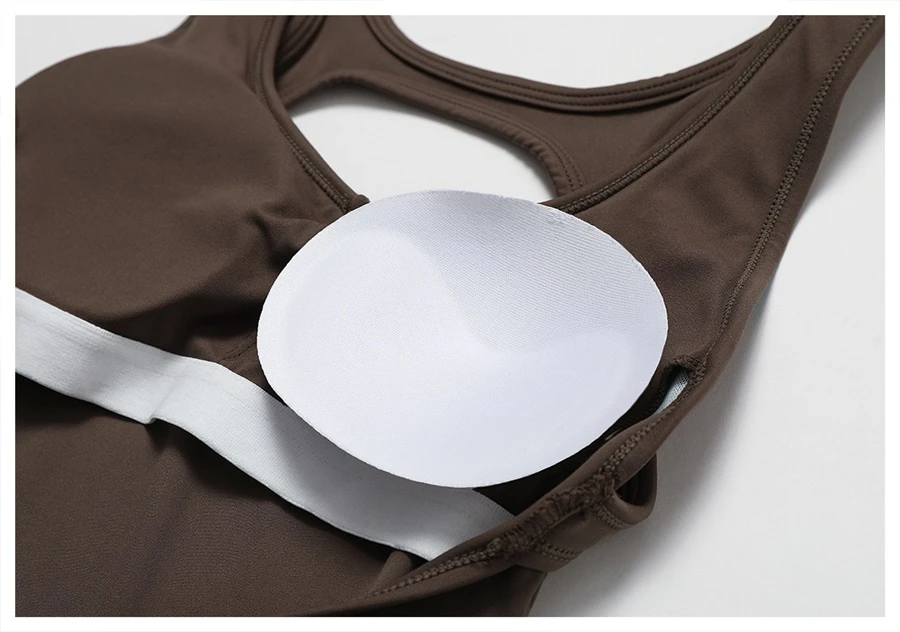 Close-up of open back design on yoga bodysuit showcasing elegant butterfly bone cut-out