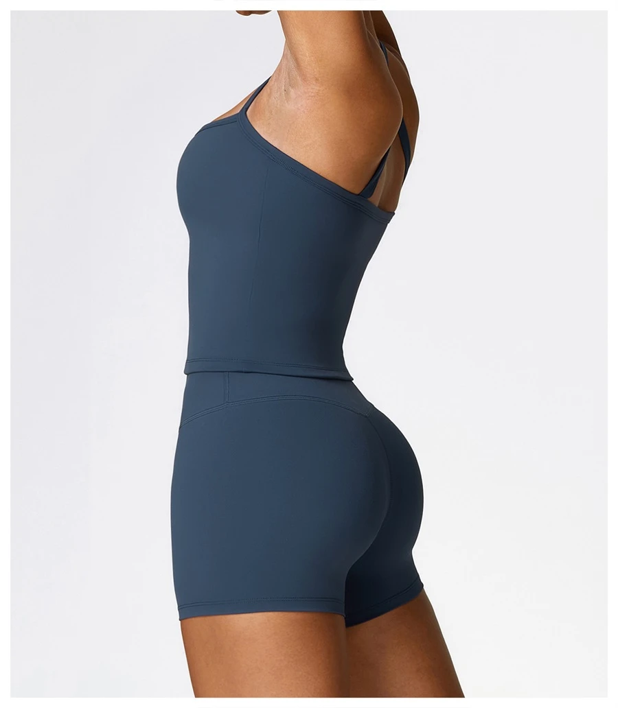 side view for Women wearing matching yoga set for yoga running and gym training, slim fit style, cami top +shorts set insignia blue