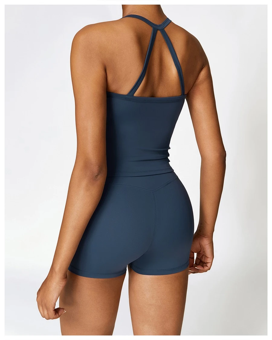 Back view for Women wearing matching yoga set for yoga running and gym training, slim fit style, cami top +shorts set insignia blue