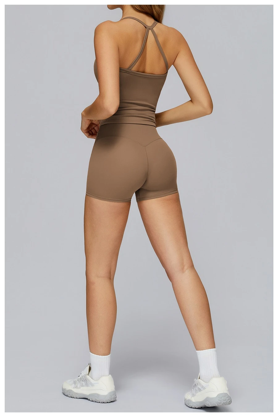Back view for Women wearing matching yoga set for yoga running and gym training, slim fit style, cami top +shorts set mocha brown
