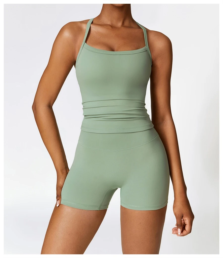 Women wearing matching yoga set for yoga running and gym training, slim fit style, cami top +shorts set basil green