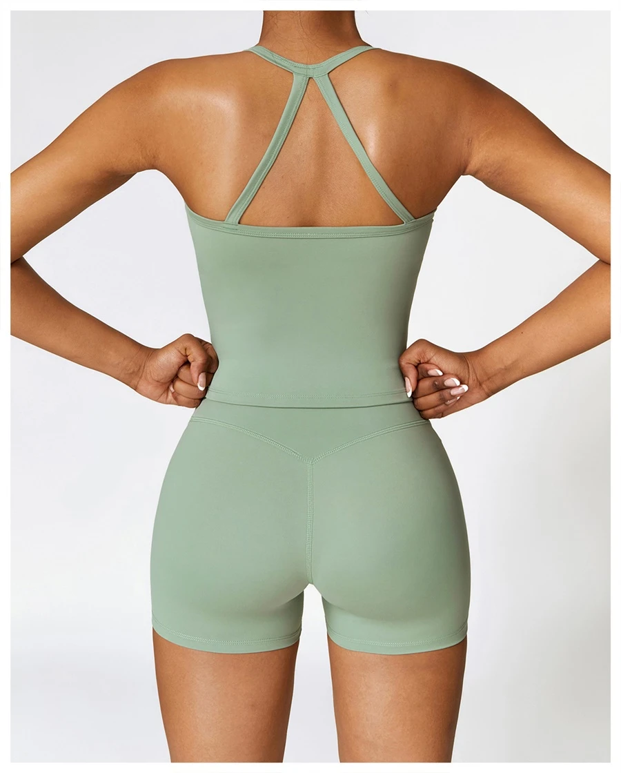 Women wearing matching yoga set for yoga running and gym training, slim fit style, cami top +shorts set basil green back