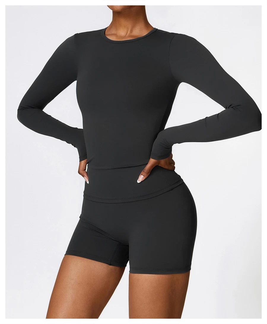 Women wearing matching yoga set for yoga running and gym training, slim fit style, long sleeve +shorts set black