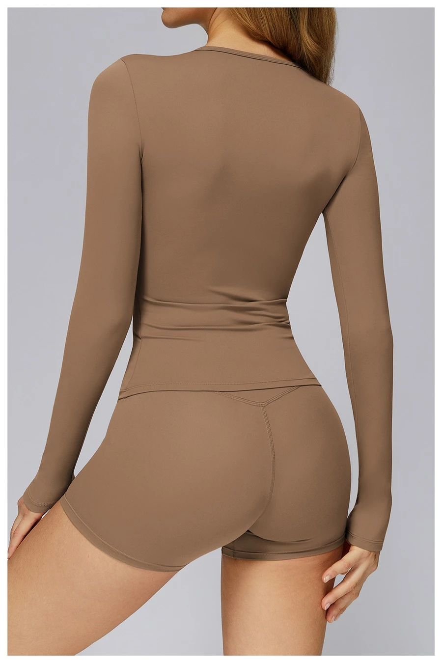 Women wearing matching yoga set for yoga running and gym training, slim fit style, long sleeve +shorts set brown