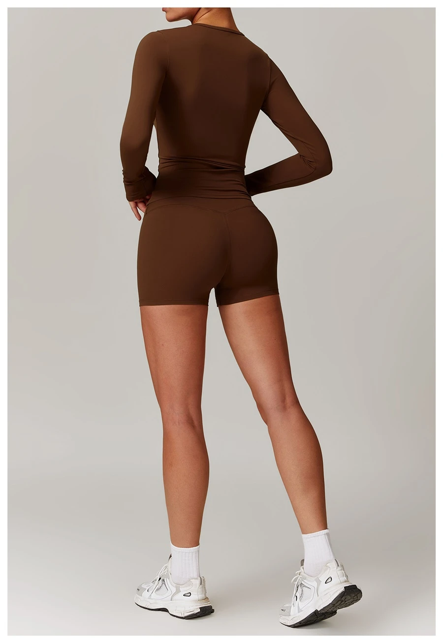Women wearing matching yoga set for yoga running and gym training, slim fit style, long sleeve +shorts set chocolate