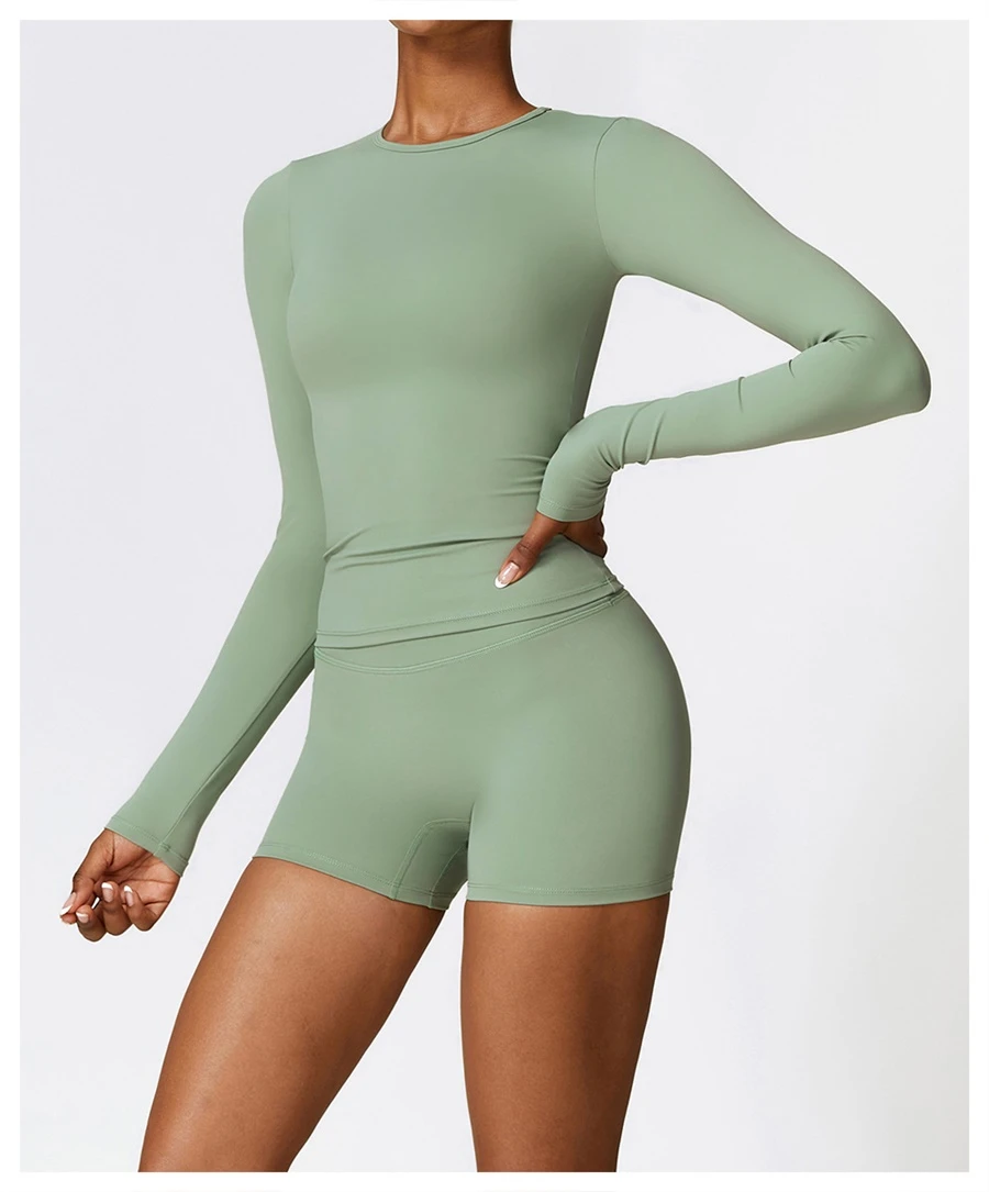 Women wearing matching yoga set for yoga running and gym training, slim fit style, long sleeve +shorts set basil green