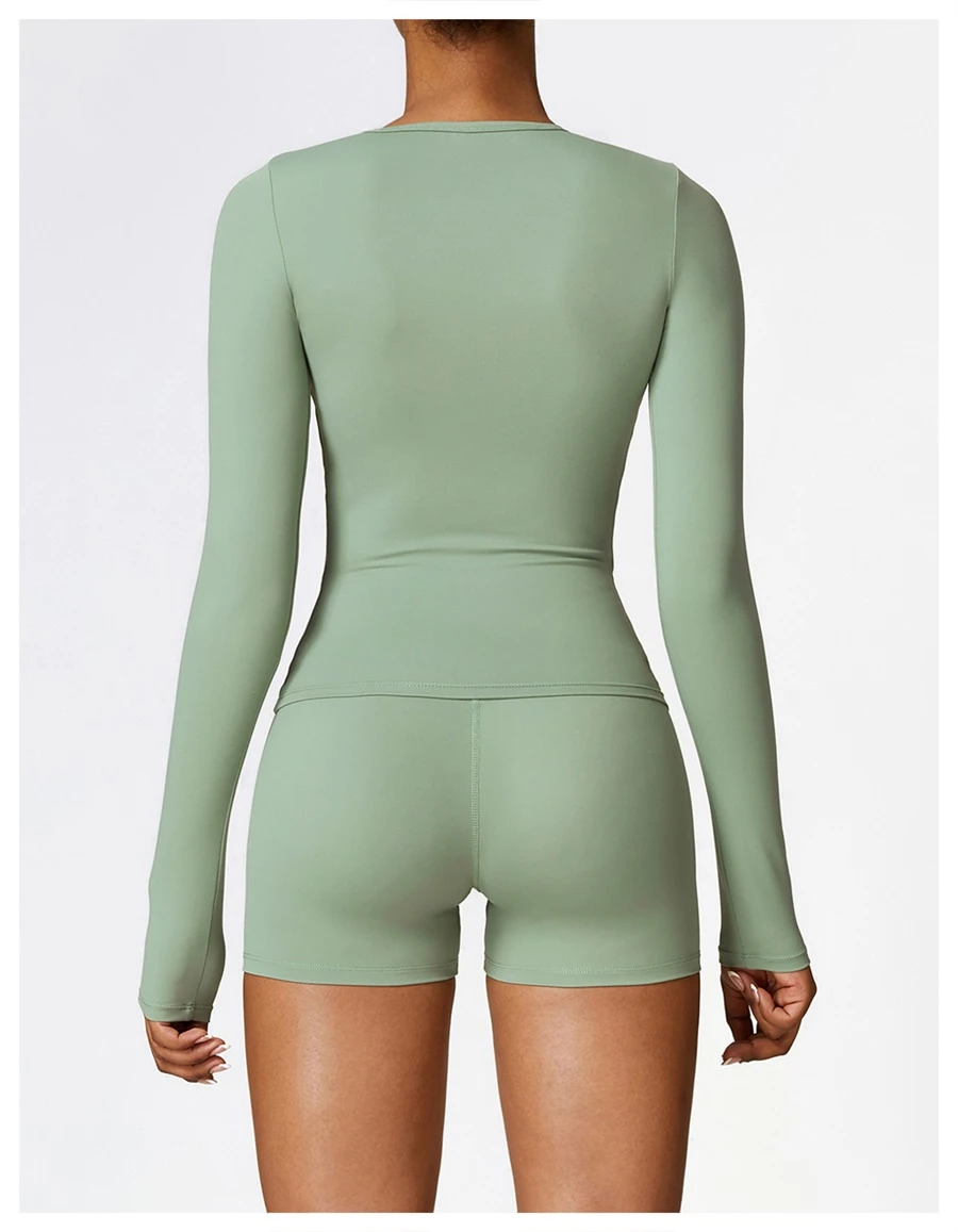 Women wearing matching yoga set for yoga running and gym training, slim fit style, long sleeve +shorts set basil green