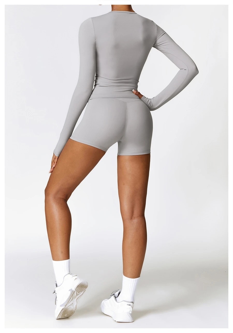 Women wearing matching yoga set for yoga running and gym training, slim fit style, long sleeve +shorts set gray