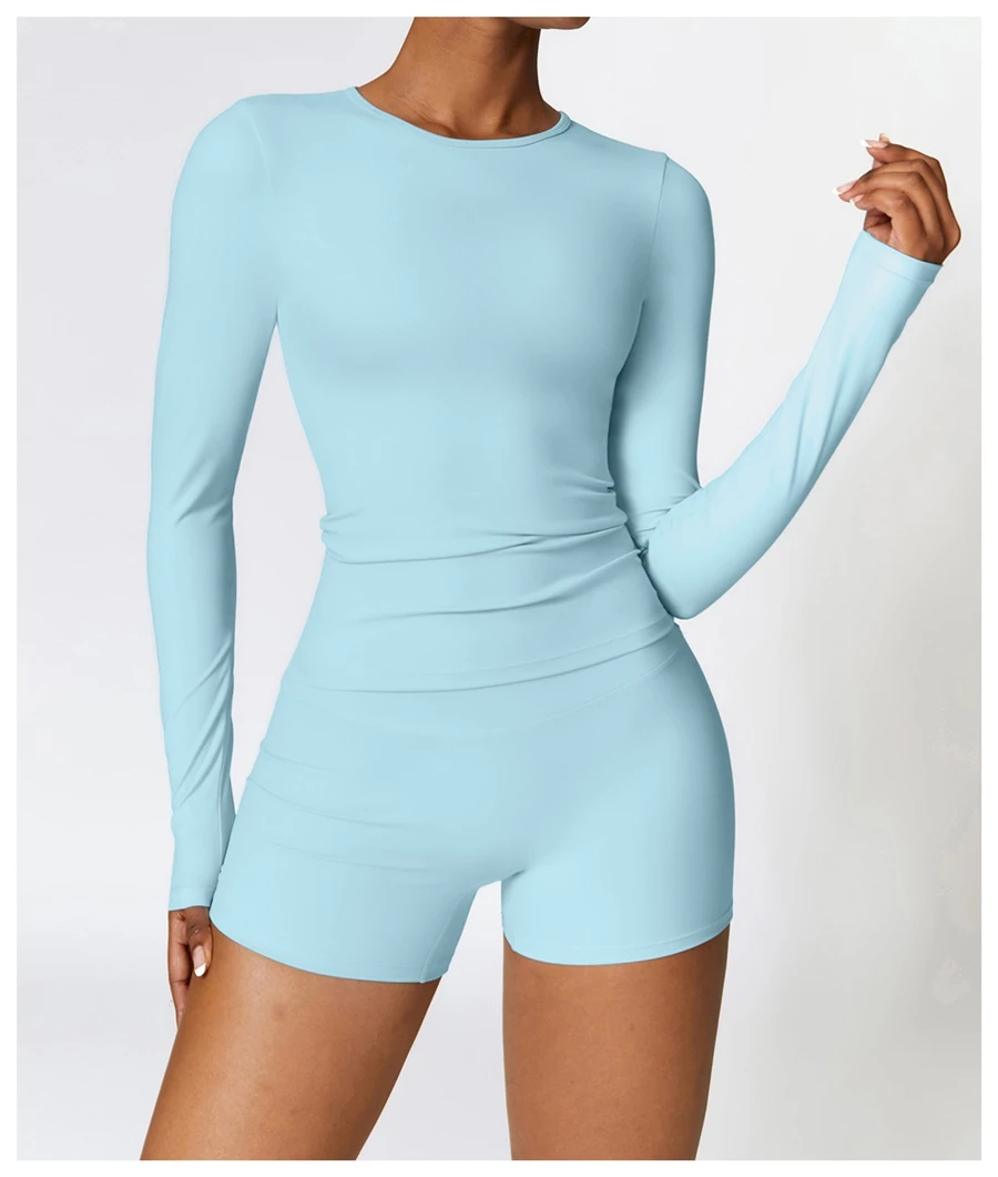 Women wearing matching yoga set for yoga running and gym training, slim fit style, long sleeve +shorts set sky blue