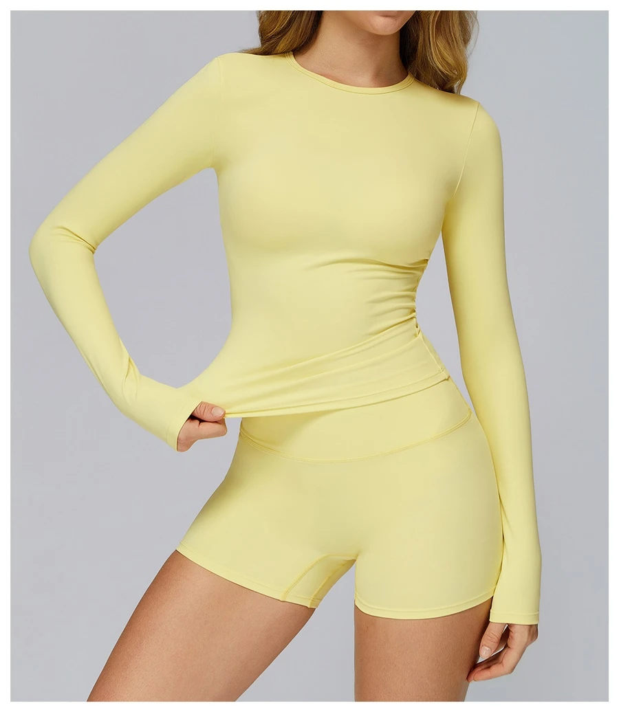 Women wearing matching yoga set for yoga running and gym training, slim fit style, long sleeve +shorts set light yellow