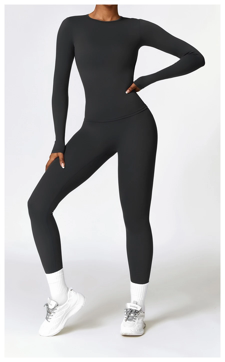Women wearing matching yoga set for yoga running and gym training, slim fit style, long sleeve +leggings set black