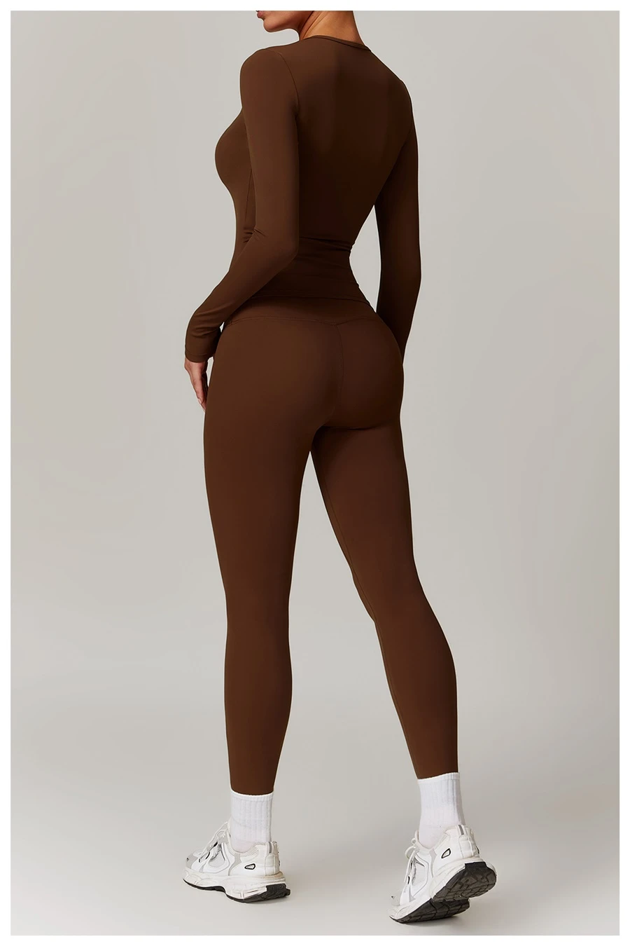 Women wearing matching yoga set for yoga running and gym training, slim fit style, long sleeve +leggings set chocolate
