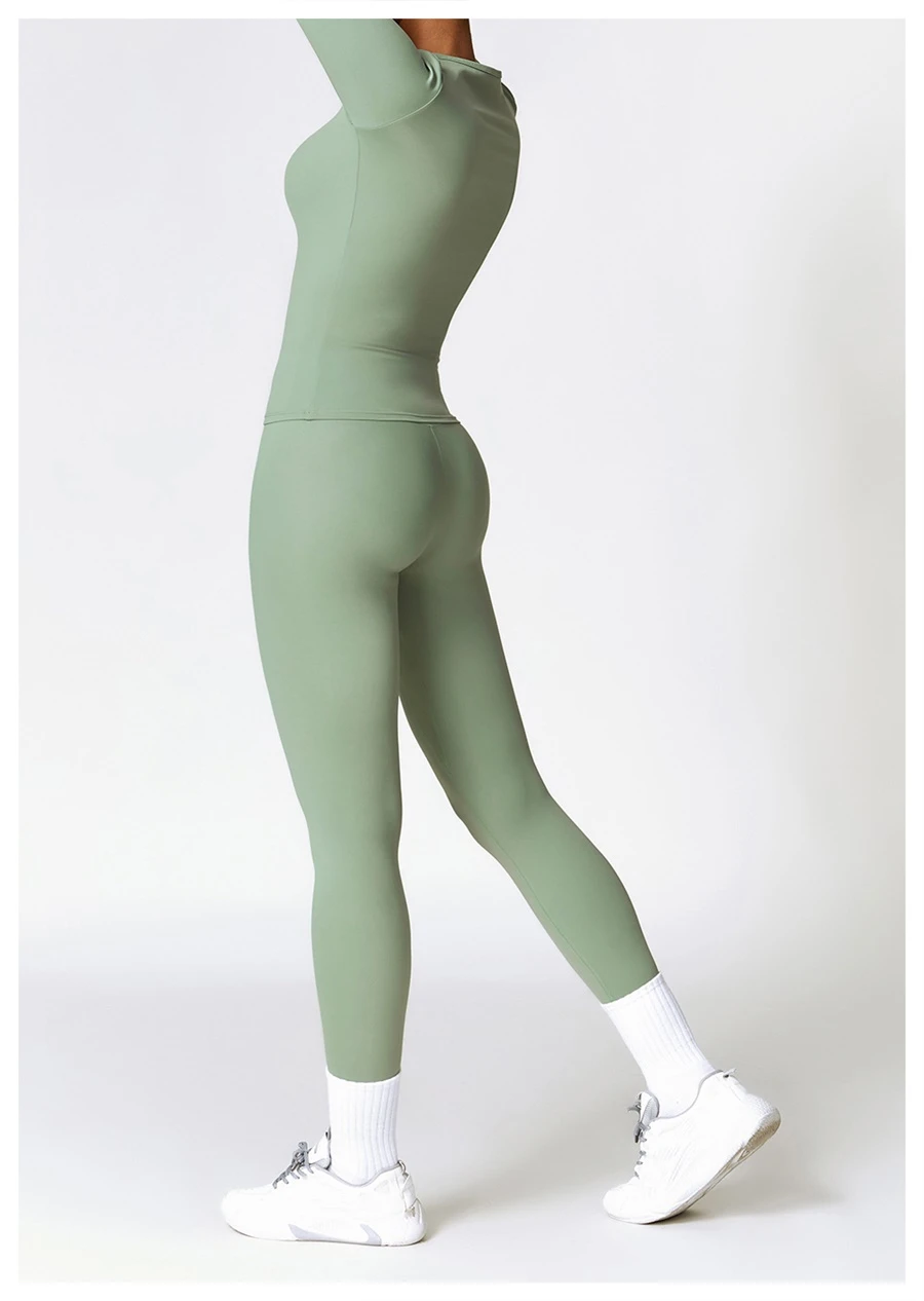 Women wearing matching yoga set for yoga running and gym training, slim fit style, long sleeve +leggings set green