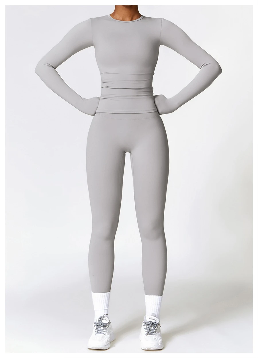 Women wearing matching yoga set for yoga running and gym training, slim fit style, long sleeve +leggings set gray