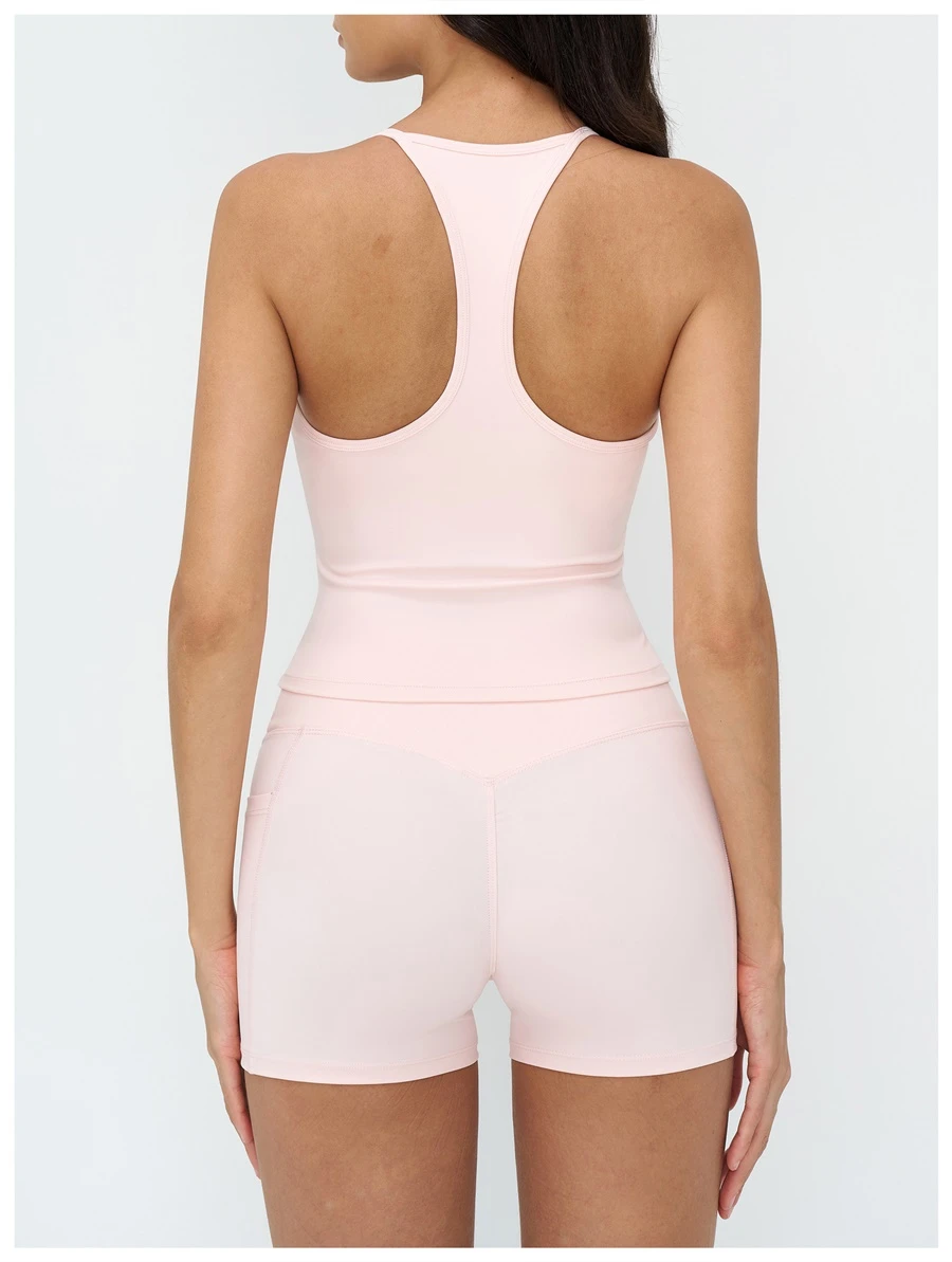 Women's racerback workout tank top highlighting open back design-light pink