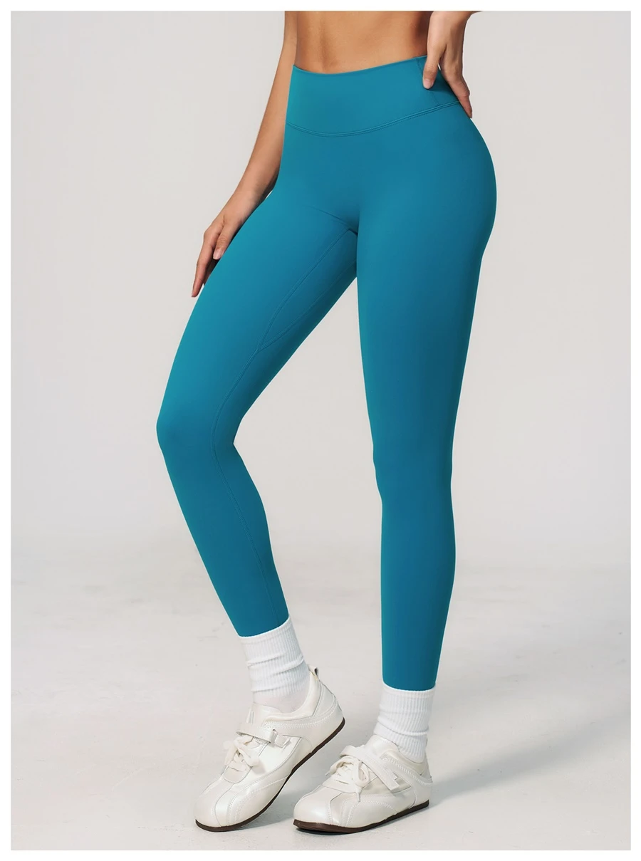 side view for Women's seamless front workout leggings made from buttery soft nylon spandex fabric-peacock blue