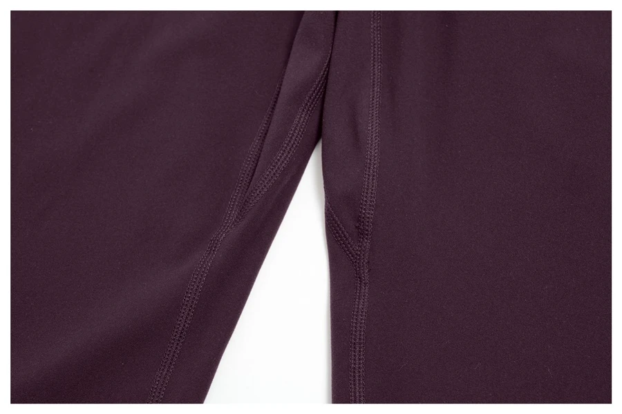 Women's seamless front workout leggings made from buttery soft nylon spandex fabric-inseam